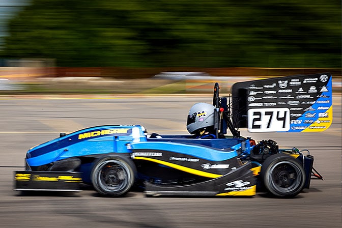 An electric race car mid-race