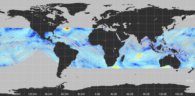 A map of the world, with oceans in gray and continents in black. Streaks of blue cover the tropical oceans, leaving only small regions of gray remaining. There is a red spot in the Atlantic, where Hurricane Sam was located. There are also yellow spots in the Indian Ocean, near the southern tip of Africa and near southwest Australia.