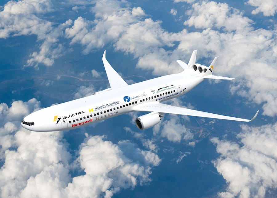 The airplane is depicted above scattered clouds. The fuselage resembles two tubes fused together with only a slight depression along the seam. The engines hang below the wings. Three fans are nestled between the two vertical stabilizers of the tail.