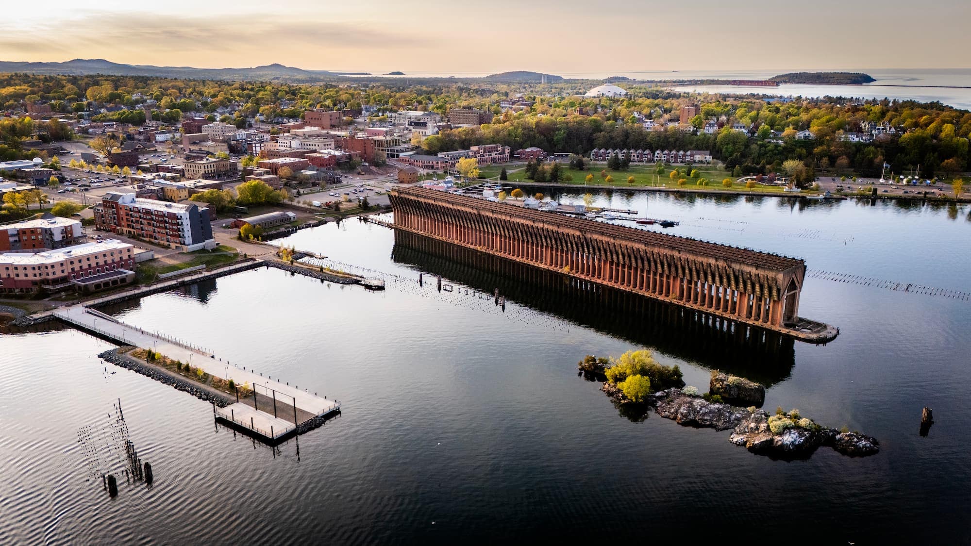 Aerial view of the historic ore dock and waterfront in downtown Marquette along Lake Superior.