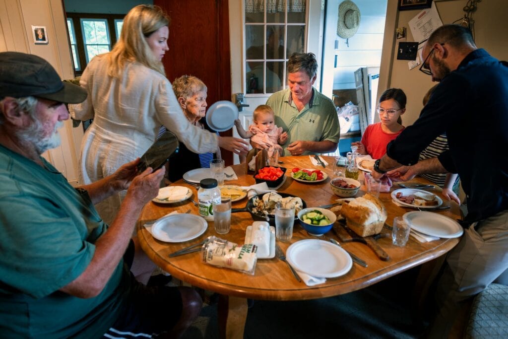 Four generations of the Lyon family gather around the kitchen table for lunch.