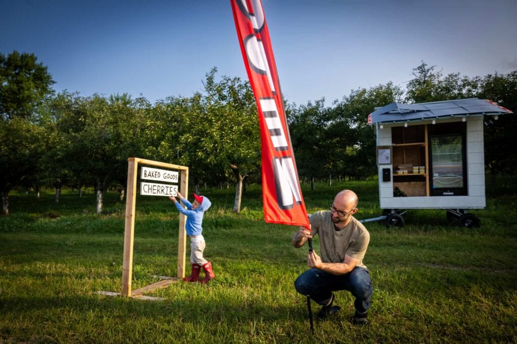 Chris Lyon and his son, Joseph, set up the family farm stand for the day.