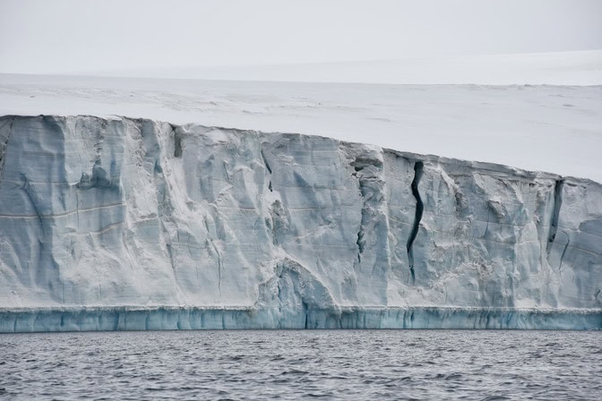 Glacier cliffs break into sea faster than predicted, but restabilize